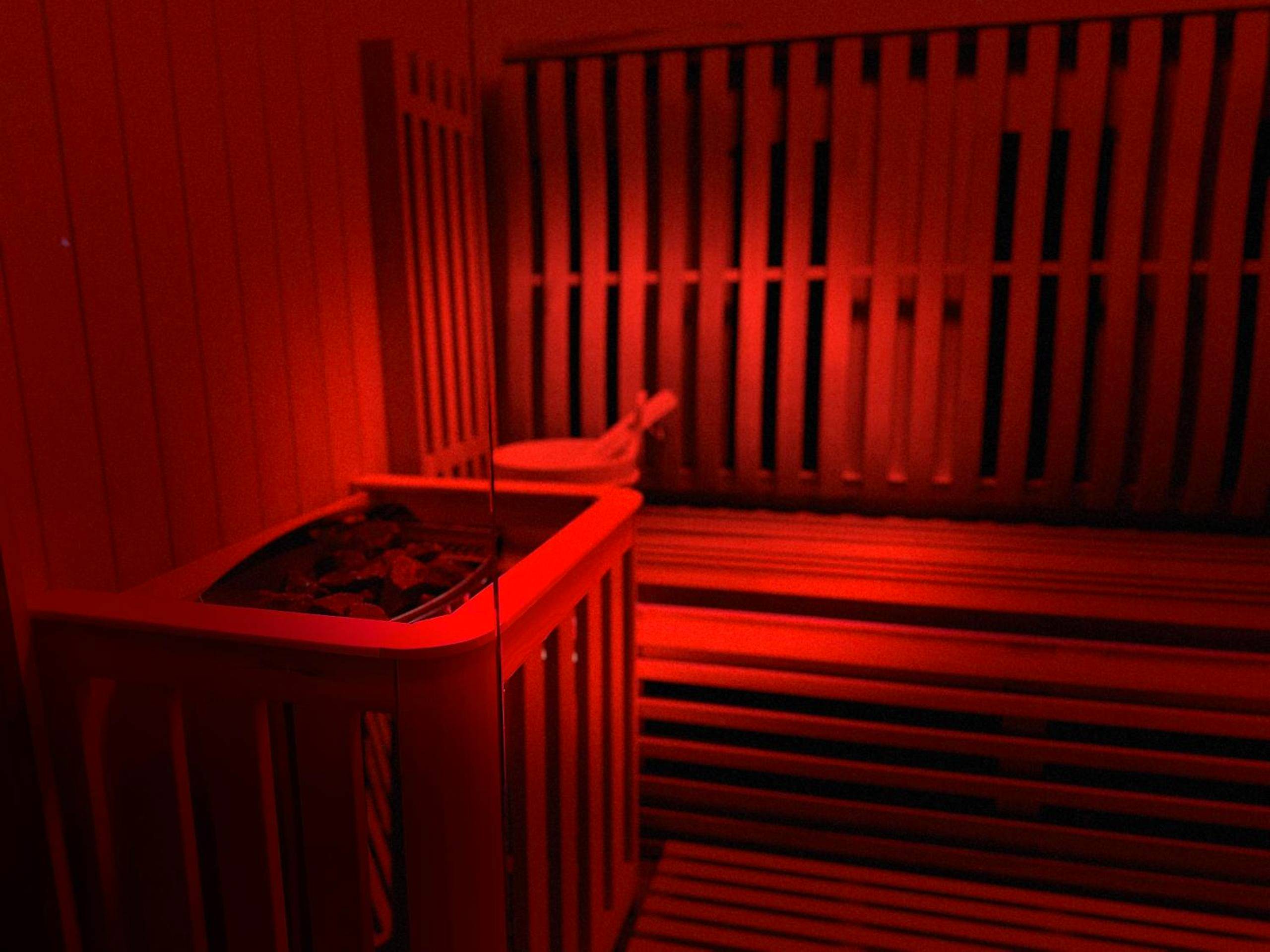 Sauna traditionnel avec lumière rouge - Appart Hotel Spa Perpignan