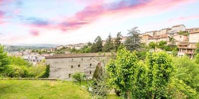 Vue panoramique sur la ville au coucher du soleil - Le Cocon Thiernois