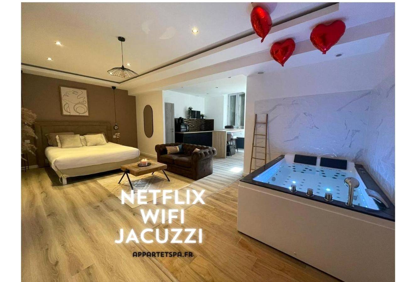 Suite ouverte avec jacuzzi et lit king size - Love Room Saint - Étienne - Eden Spa ST Etienne
