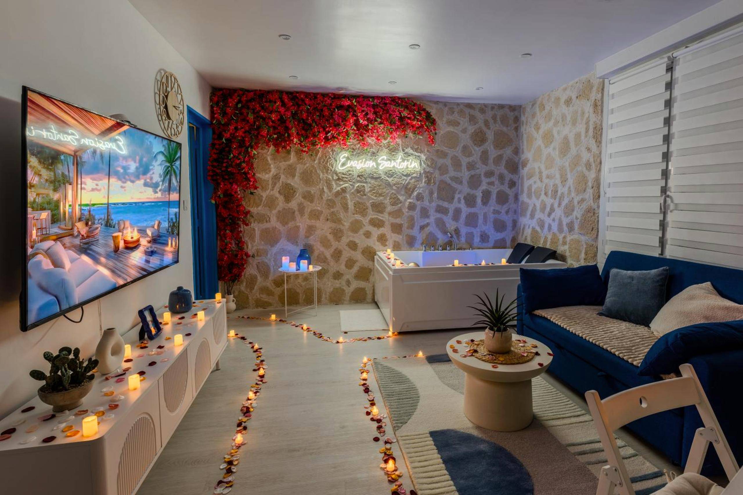 Ambiance romantique avec bougies et pétales - Évasion Santorin - Jacuzzi & Relax