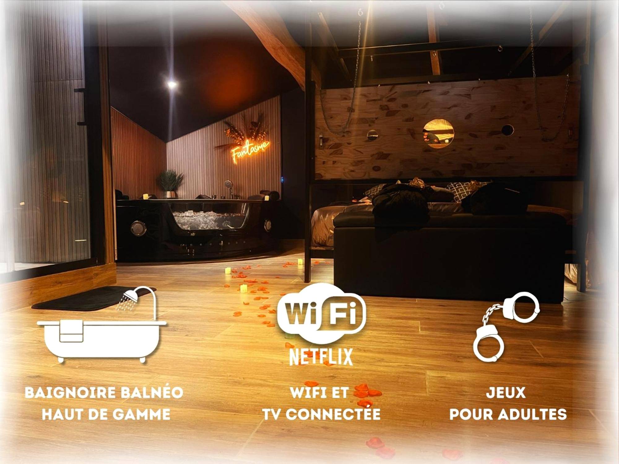 Baignoire balnéo et lit avec pétales de rose - Love Room Jonzac - Love Room Fantasme 50 Nuances