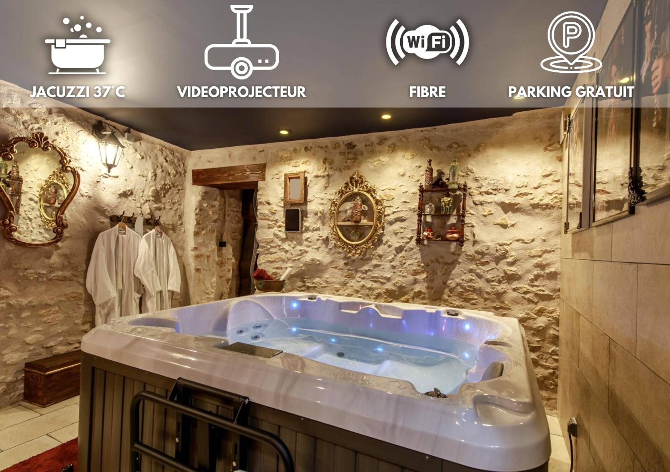 Jacuzzi privatif dans pièce aux murs en pierre - Love Room Longeville - lès - Metz - Le Spa du Sorcier