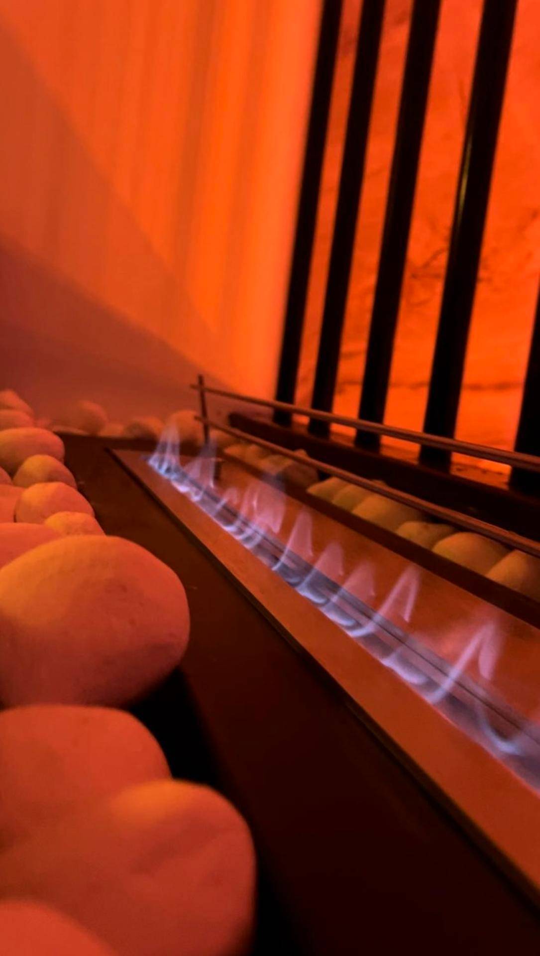 Cheminée au bioéthanol et galets blancs - Sparadise : Jacuzzi et Sauna