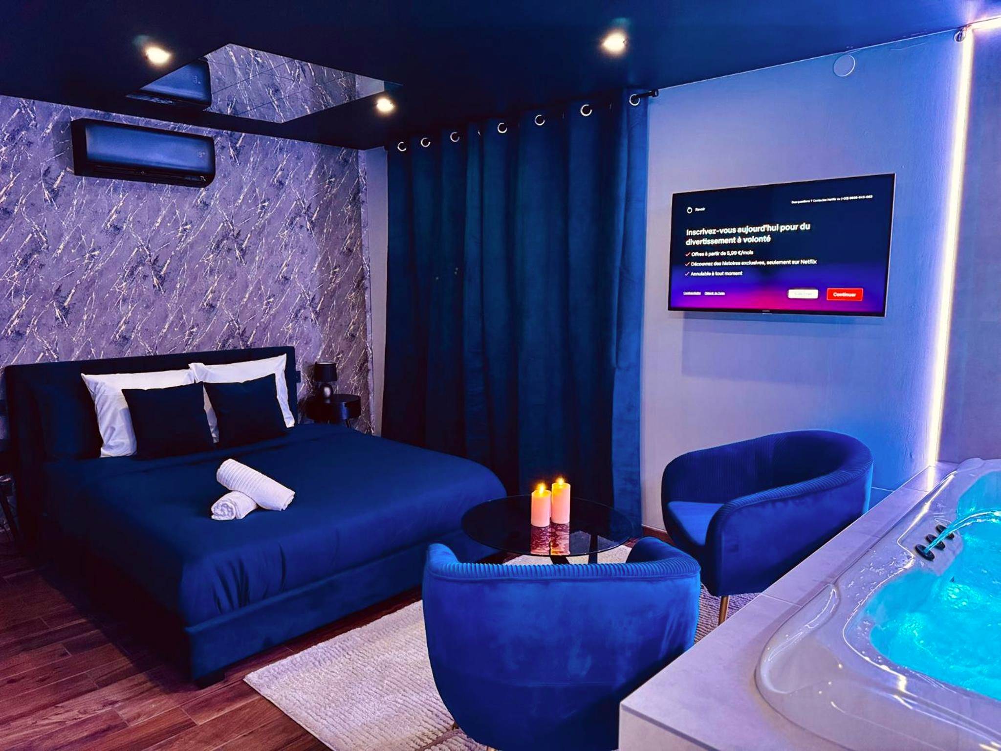 Suite romantique avec lit, TV et jacuzzi - La Suite Élixir & Spa