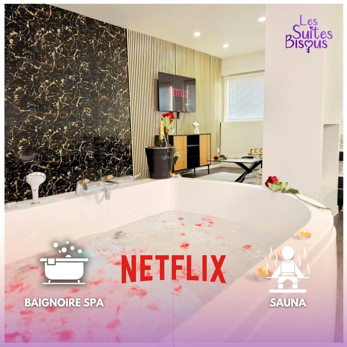 Baignoire spa avec pétales de rose et TV - Love Room Metz - Les Suites Bisous Metz - Jacuzzi & Private Sauna